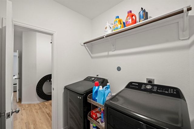 908 Pickering Oak Row, Magnolia, TX 77354 - laundry room featuring laundry area, light wood-style floors, and washer and clothes dryer