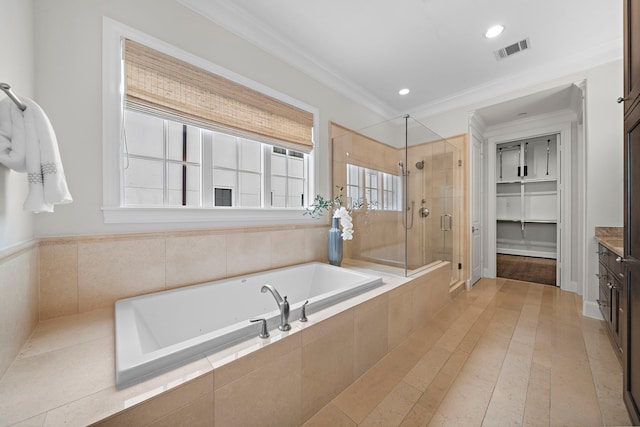 5412 Jackson St, Houston, TX 77004 - bathroom featuring a shower stall, a bath, vanity, ornamental molding, and recessed lighting
