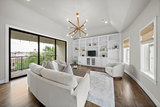 5412 Jackson St, Houston, TX 77004 - living area with vaulted ceiling, a chandelier, dark wood finished floors, and baseboards
