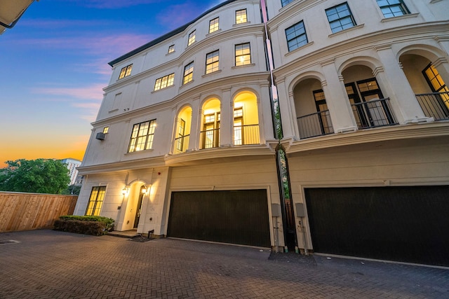 5412 Jackson St, Houston, TX 77004 - view of property featuring an attached garage, a balcony, and driveway