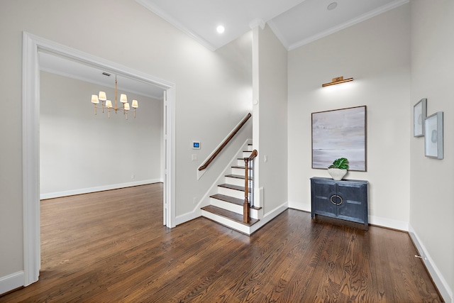 5412 Jackson St, Houston, TX 77004 - foyer entrance with ornamental molding, wood finished floors, stairs, a chandelier, and baseboards