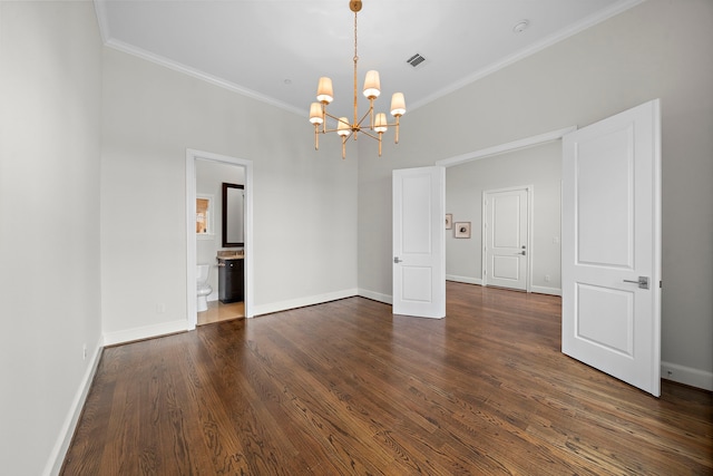5412 Jackson St, Houston, TX 77004 - empty room with a chandelier, ornamental molding, dark wood-style flooring, baseboards, and a smoke detector