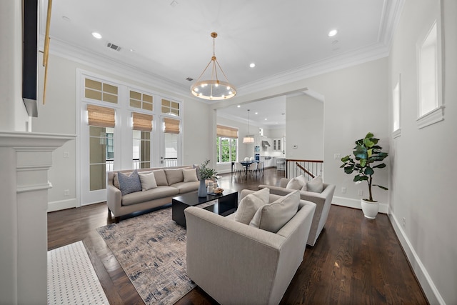 5412 Jackson St, Houston, TX 77004 - living room with a chandelier, dark wood-style flooring, ornamental molding, baseboards, and recessed lighting