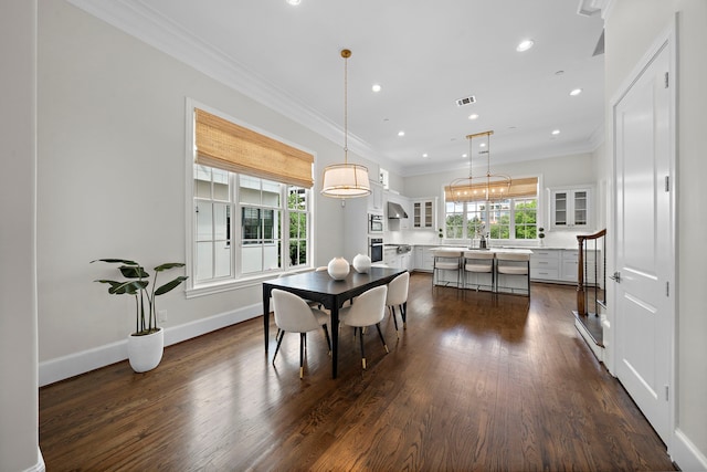 5412 Jackson St, Houston, TX 77004 - dining area with dark wood-style floors, recessed lighting, ornamental molding, and baseboards