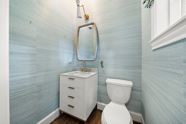 5412 Jackson St, Houston, TX 77004 - bathroom with toilet, vanity, baseboards, and wood finished floors