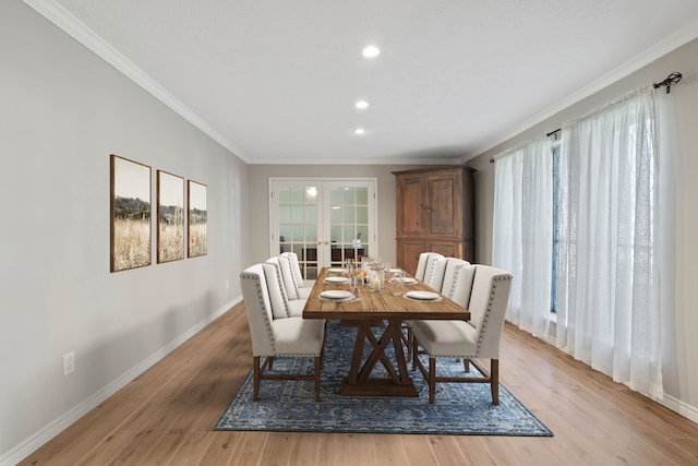 6615 Ampton Dr, Spring, TX 77379 - dining space featuring crown molding, french doors, baseboards, light wood finished floors, and recessed lighting