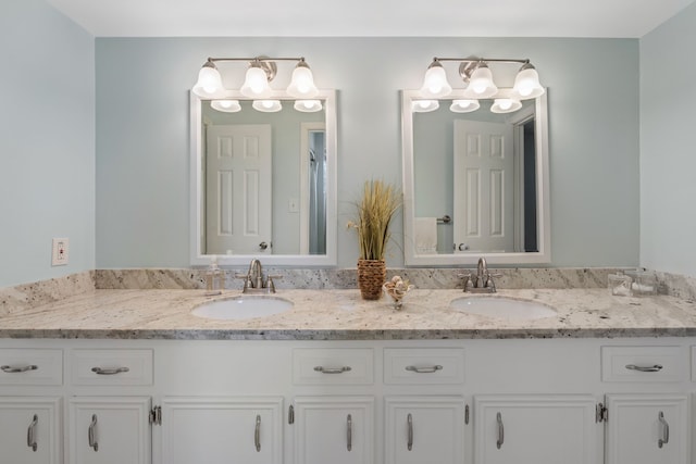 6615 Ampton Dr, Spring, TX 77379 - bathroom featuring double vanity and an enclosed shower