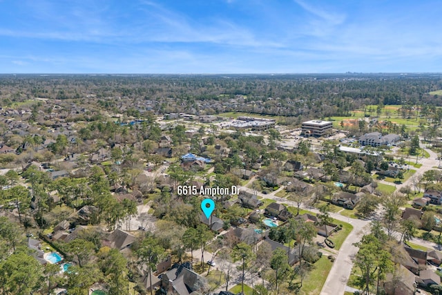 6615 Ampton Dr, Spring, TX 77379 - aerial view of property and surrounding area featuring nearby suburban area and a heavily wooded area