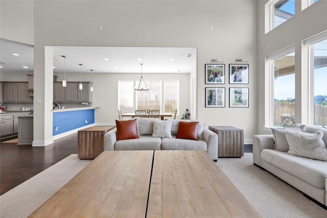 437 Ripple Edge Ct, Katy, TX 77493 - living room with plenty of natural light, recessed lighting, a towering ceiling, baseboards, and a chandelier