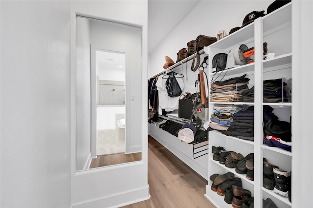437 Ripple Edge Ct, Katy, TX 77493 - walk in closet with wood finished floors