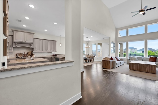 437 Ripple Edge Ct, Katy, TX 77493 - kitchen with gray cabinetry, dark wood-style floors, a ceiling fan, open floor plan, and backsplash