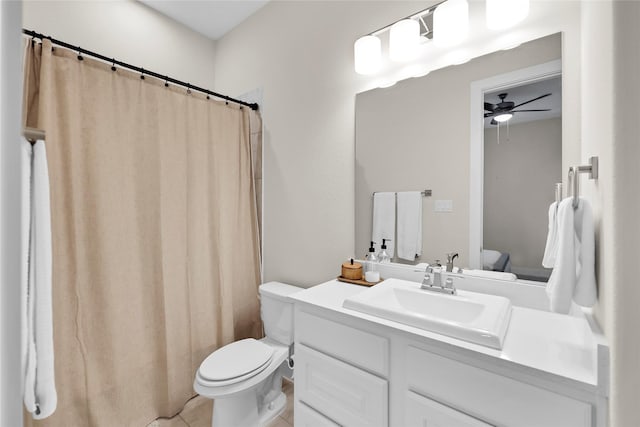 437 Ripple Edge Ct, Katy, TX 77493 - full bathroom featuring toilet, vanity, a ceiling fan, tile patterned floors, and a shower with shower curtain