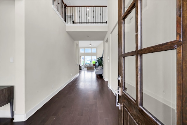 437 Ripple Edge Ct, Katy, TX 77493 - foyer entrance with dark wood finished floors, a high ceiling, and baseboards