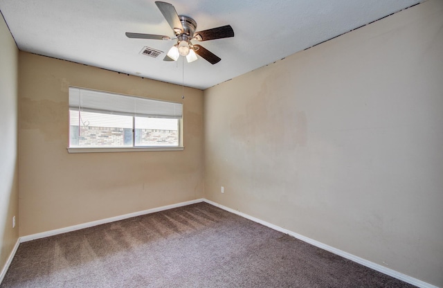 unfurnished room with visible vents, baseboards, ceiling fan, and carpet floors