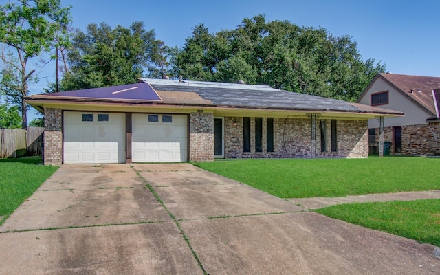 ranch-style home featuring fence, brick siding, concrete driveway, a garage, and a front yard