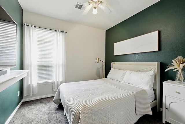 15226 Loys Coves Ct, Humble, TX 77396 - carpeted bedroom featuring baseboards, multiple windows, and ceiling fan