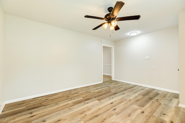unfurnished room with baseboards, light wood-style floors, and ceiling fan