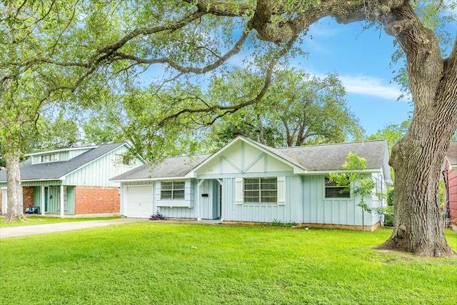 ranch-style house featuring concrete driveway, a front lawn, a shingled roof, and a garage
