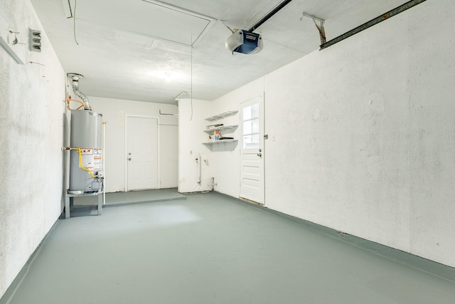 garage featuring water heater and a garage door opener