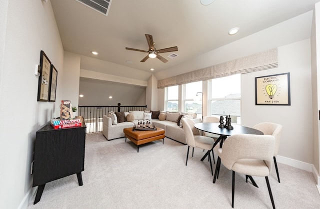 18715 Brego Ln, Tomball, TX 77377 - living area featuring light carpet, baseboards, a ceiling fan, and visible vents