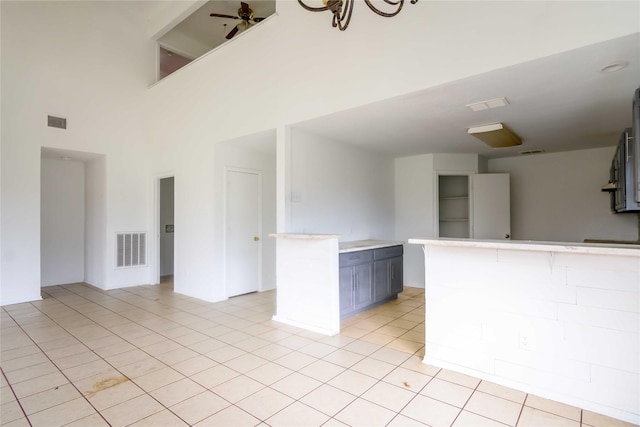 4411 Osage Dr, Baytown, TX 77521 - interior space with light tile patterned floors, visible vents, a towering ceiling, and ceiling fan