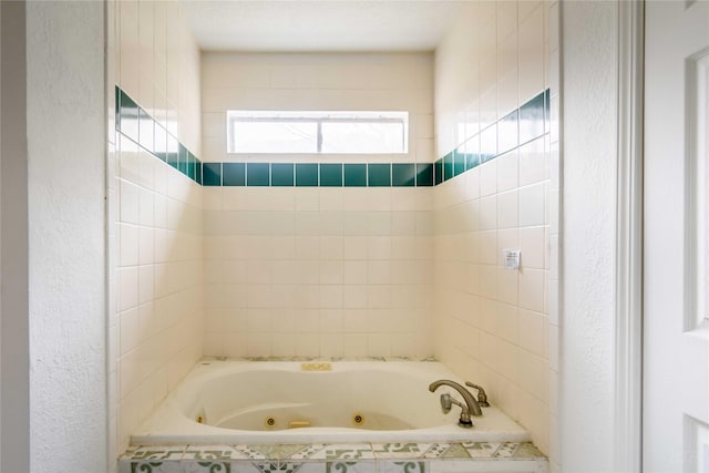 4411 Osage Dr, Baytown, TX 77521 - bathroom with a jetted tub and a textured wall