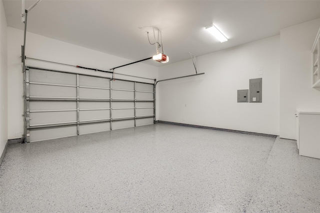 garage with electric panel and a garage door opener