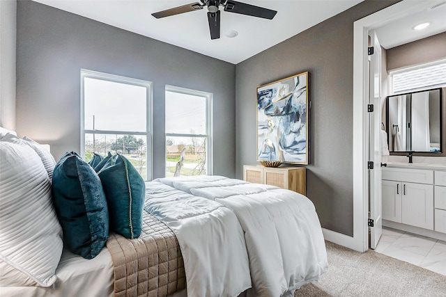 bedroom featuring marble finish floor, ensuite bath, recessed lighting, ceiling fan, and baseboards