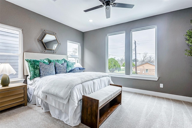 carpeted bedroom with baseboards, ceiling fan, and recessed lighting