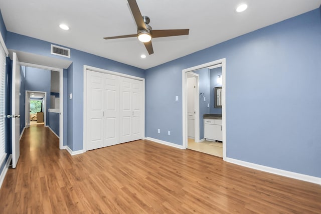 7655 S Braeswood Blvd Unit 10, Houston, TX 77071 - unfurnished bedroom with light wood-style flooring, baseboards, a closet, recessed lighting, and a ceiling fan