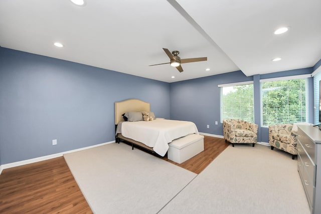 7655 S Braeswood Blvd Unit 10, Houston, TX 77071 - bedroom featuring wood finished floors, baseboards, recessed lighting, and ceiling fan