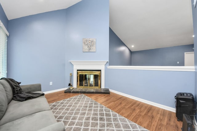 7655 S Braeswood Blvd Unit 10, Houston, TX 77071 - living room with vaulted ceiling, wood finished floors, baseboards, a tile fireplace, and recessed lighting