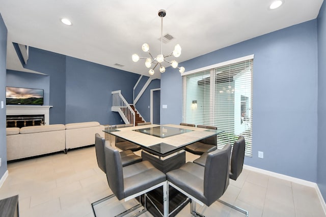 7655 S Braeswood Blvd Unit 10, Houston, TX 77071 - dining room featuring stairs, a chandelier, baseboards, light tile patterned floors, and recessed lighting
