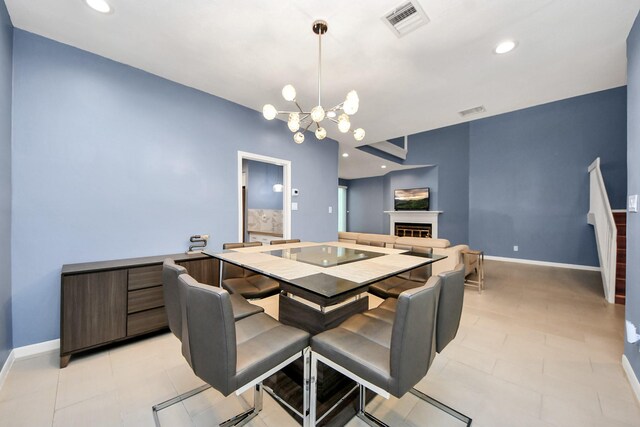 7655 S Braeswood Blvd Unit 10, Houston, TX 77071 - dining area with a fireplace, baseboards, a chandelier, and recessed lighting