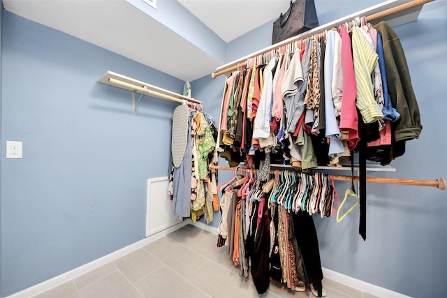 7655 S Braeswood Blvd Unit 10, Houston, TX 77071 - walk in closet featuring tile patterned floors