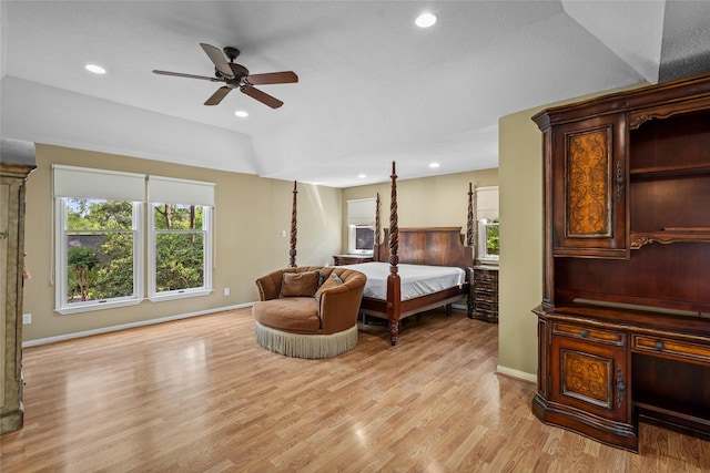 bedroom with multiple windows, light wood-style flooring, baseboards, and recessed lighting