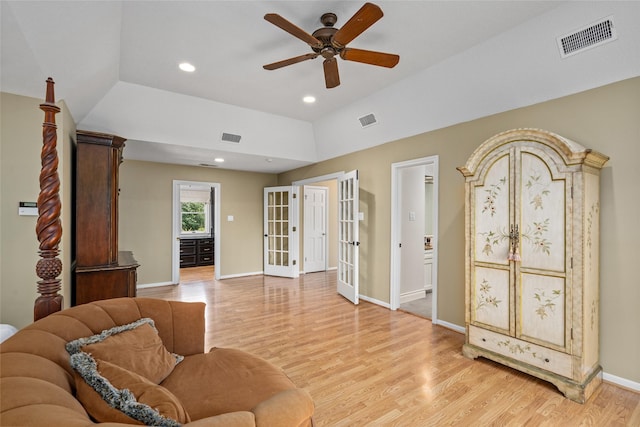 living area with french doors, light wood finished floors, a ceiling fan, baseboards, and recessed lighting