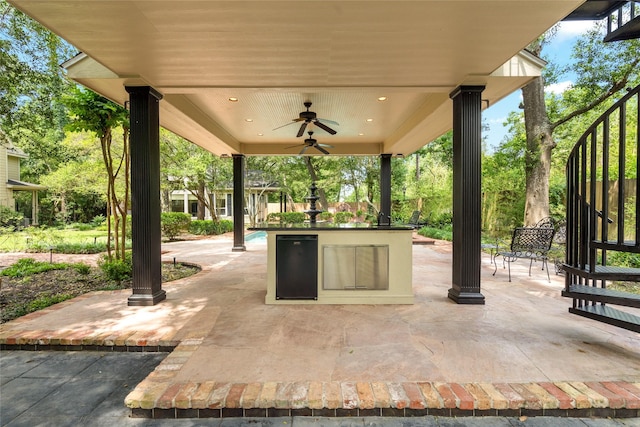 view of patio featuring ceiling fan