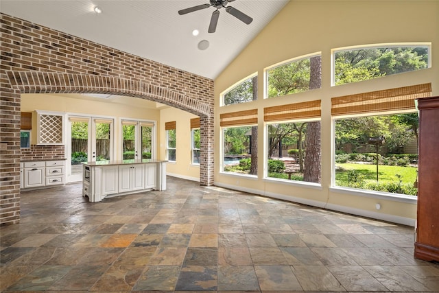 unfurnished sunroom with lofted ceiling