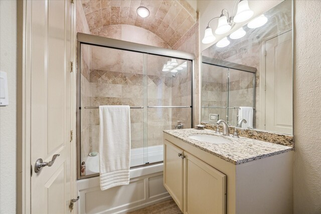 6417 Rodrigo St, Houston, TX 77007 - bathroom featuring enclosed tub / shower combo, vanity, and a textured wall