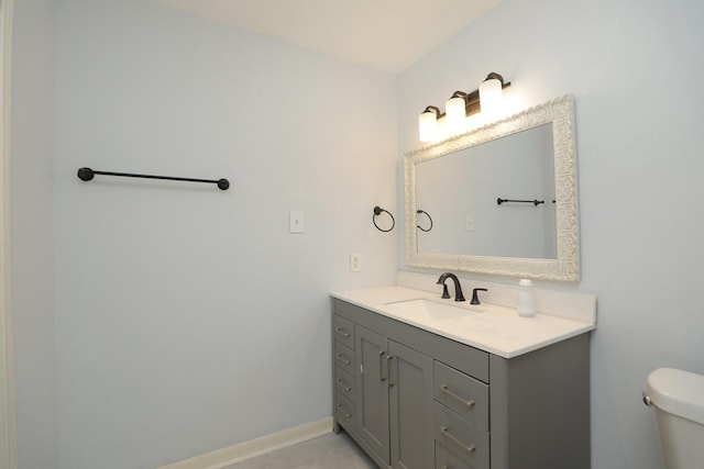 bathroom with toilet and vanity