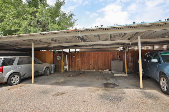 covered parking lot with fence