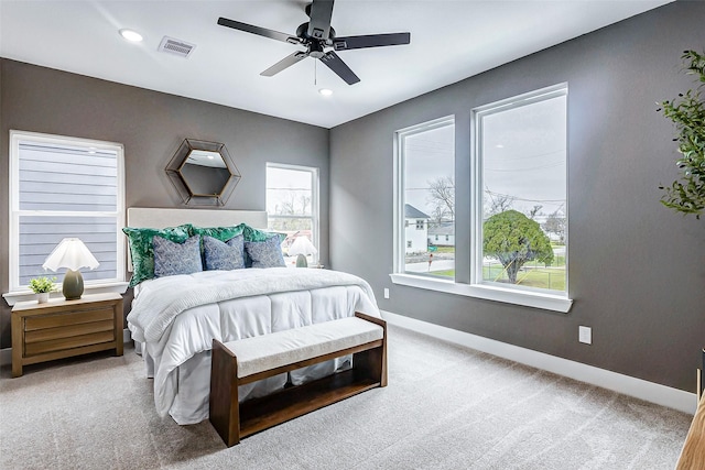 bedroom with baseboards, recessed lighting, carpet flooring, and visible vents