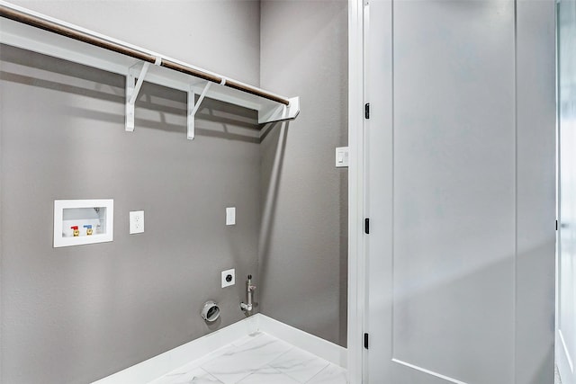 laundry area with laundry area, gas dryer hookup, hookup for an electric dryer, hookup for a washing machine, and marble finish floor