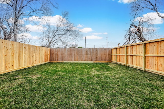 view of yard featuring a fenced backyard