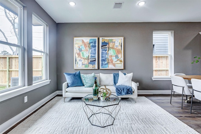 living room with visible vents, a healthy amount of sunlight, and recessed lighting