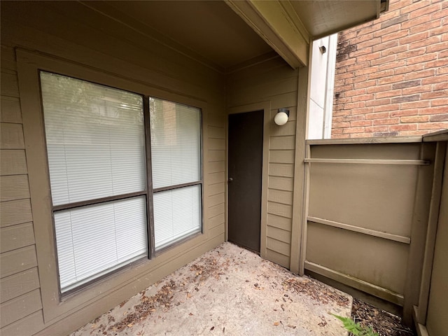 property entrance with brick siding