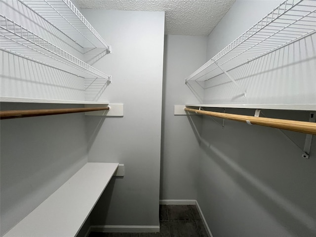 spacious closet with tile patterned floors