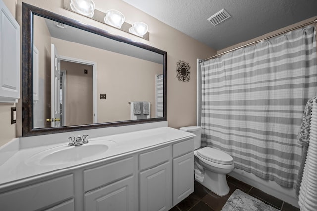 full bath with a textured ceiling, toilet, visible vents, tile patterned flooring, and vanity