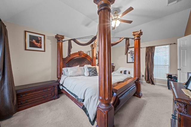 bedroom featuring lofted ceiling, carpet, baseboards, ceiling fan, and visible vents